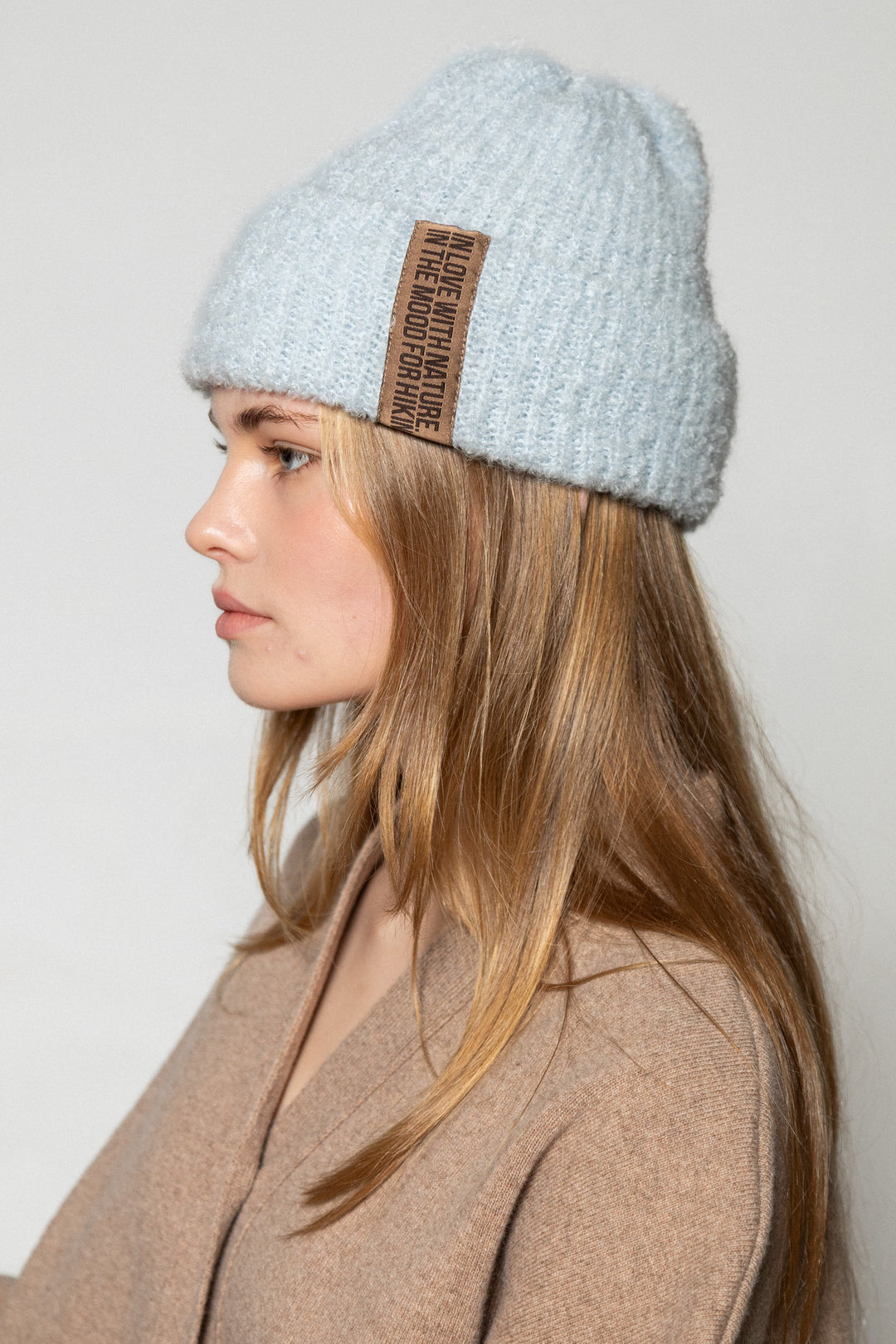 LIGHT BLUE TEDDY ALPACA BEANIE WITH CHOCOLATE LABEL